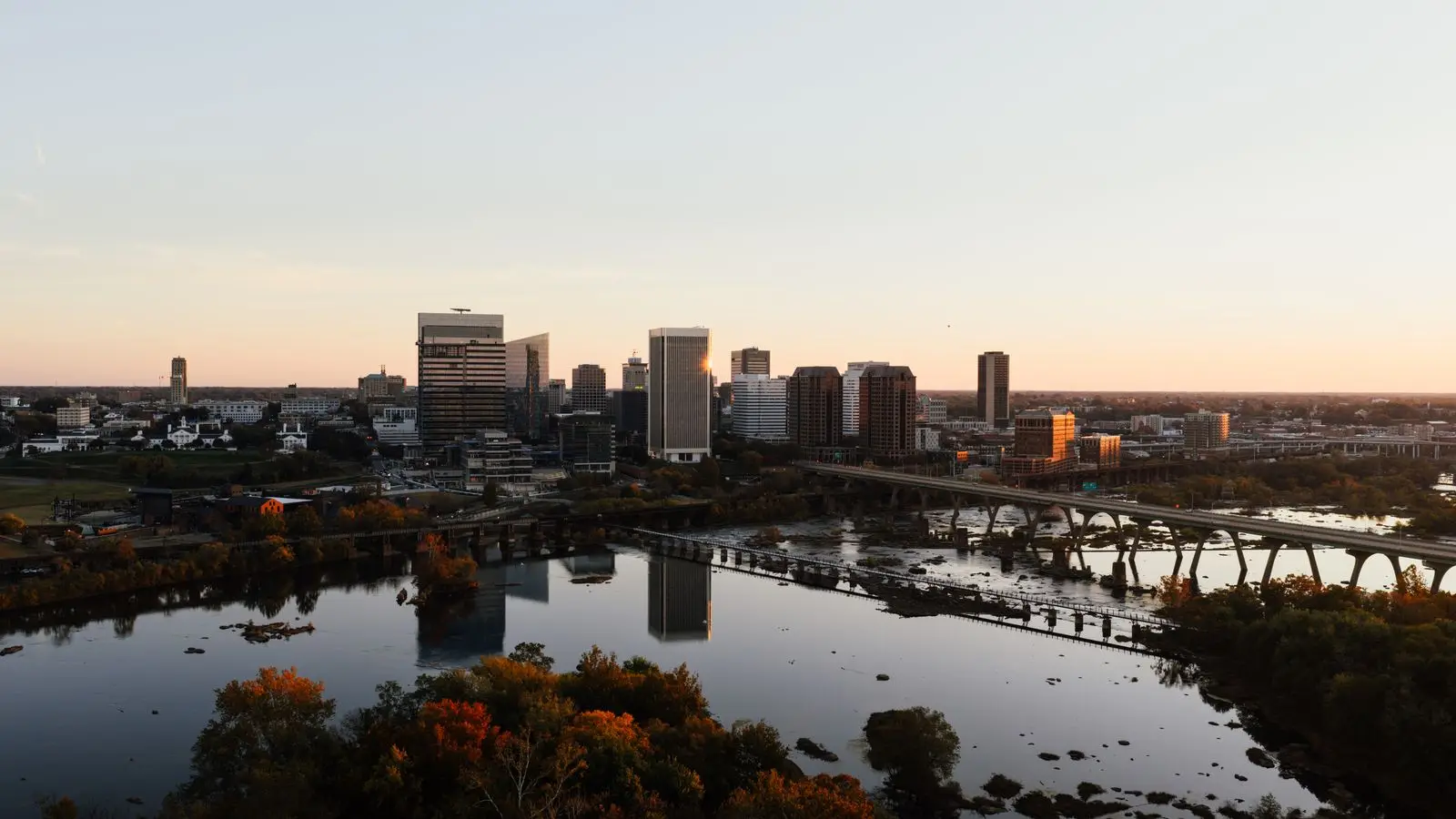 Richmond, Virginia skyline at sunset over the James River